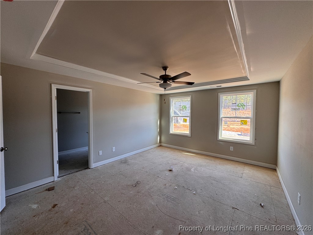 244 Rough Rdg Trail Aberdeen, NC 28315 - Photo 13 of 25 an empty room with windows and fan