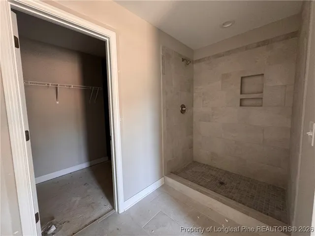 a bathroom with a glass shower door
