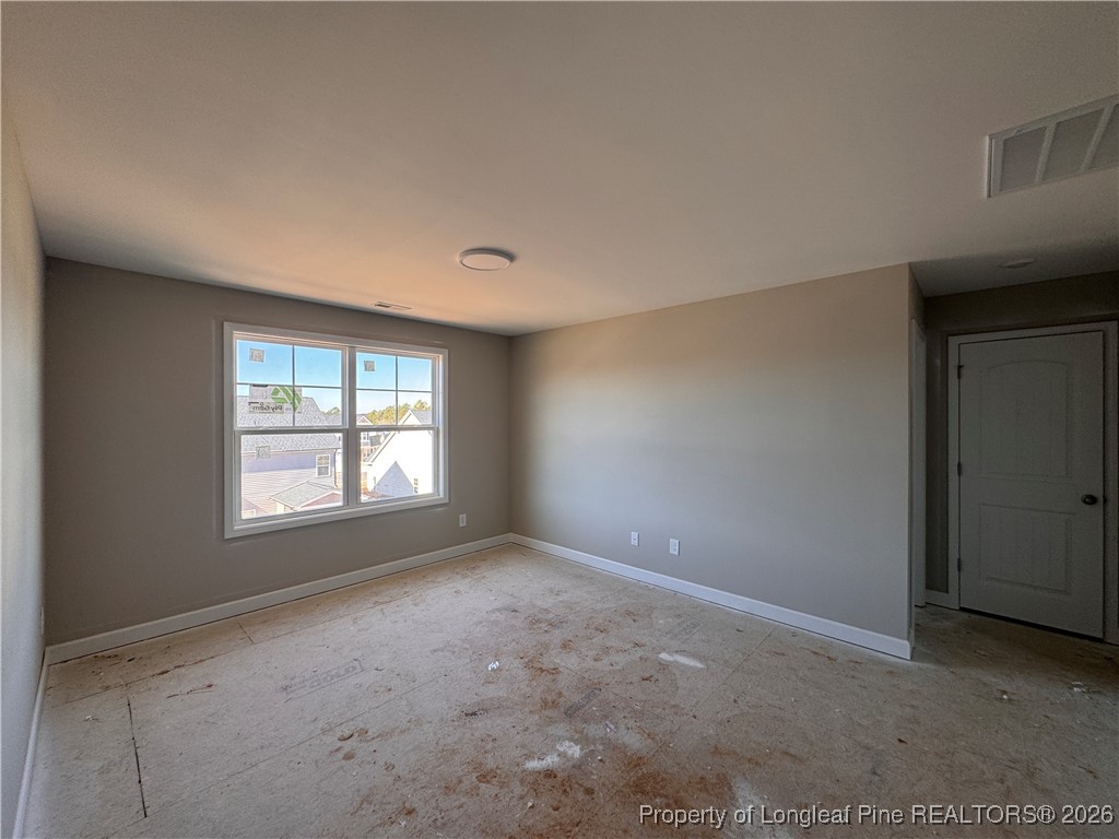244 Rough Rdg Trail Aberdeen, NC 28315 - Photo 19 of 25 a view of an empty room with a window