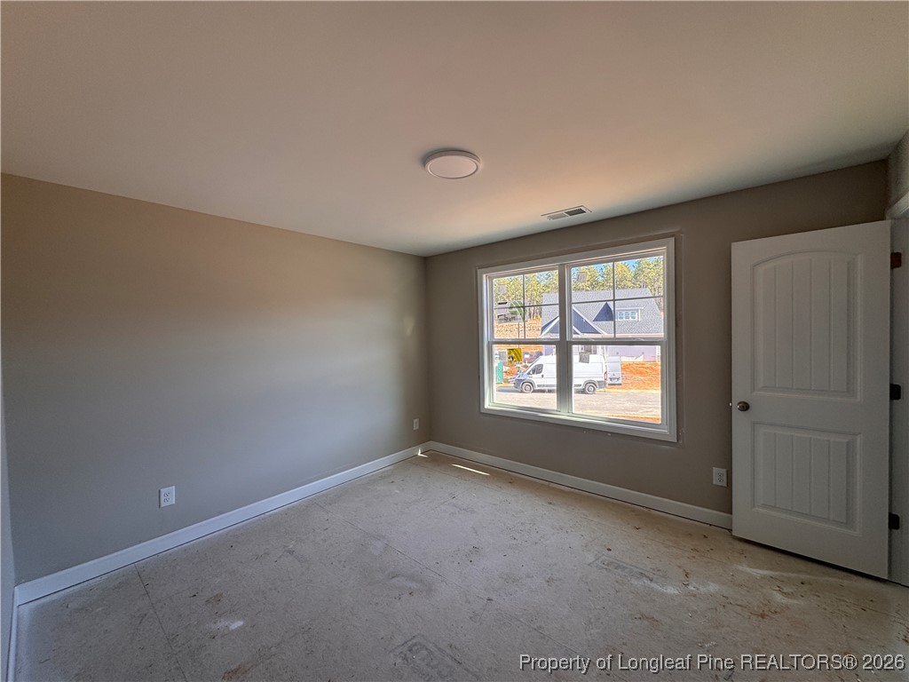 244 Rough Rdg Trail Aberdeen, NC 28315 - Photo 22 of 25 an empty room with a window