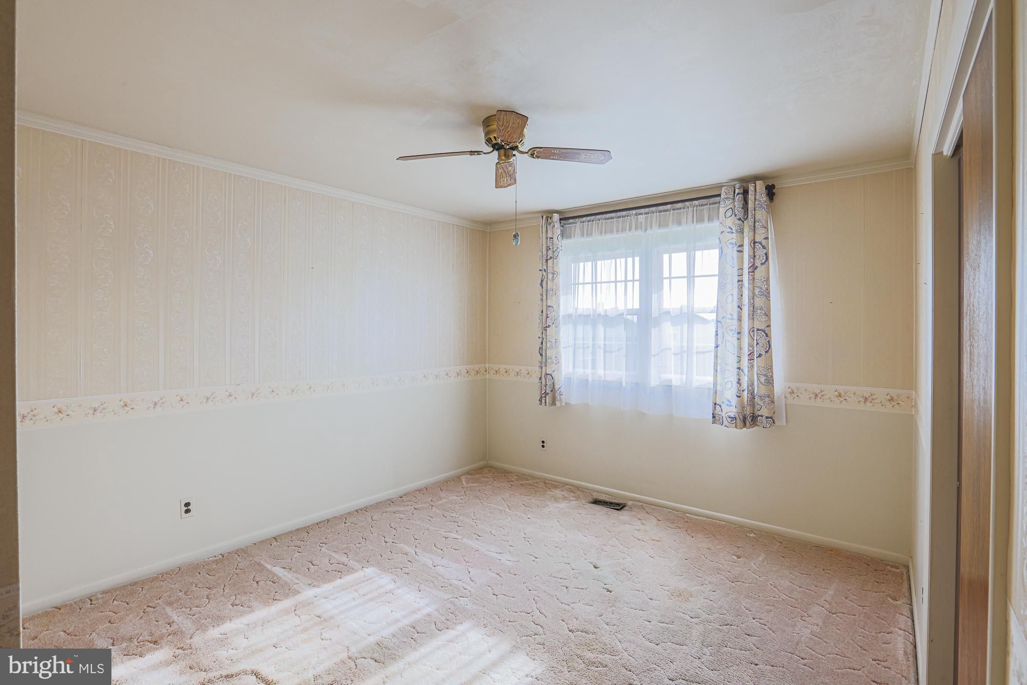 1522 Chivalry Court Rosedale, MD 21237 - Photo 21 of 36 a view of an empty room with a window