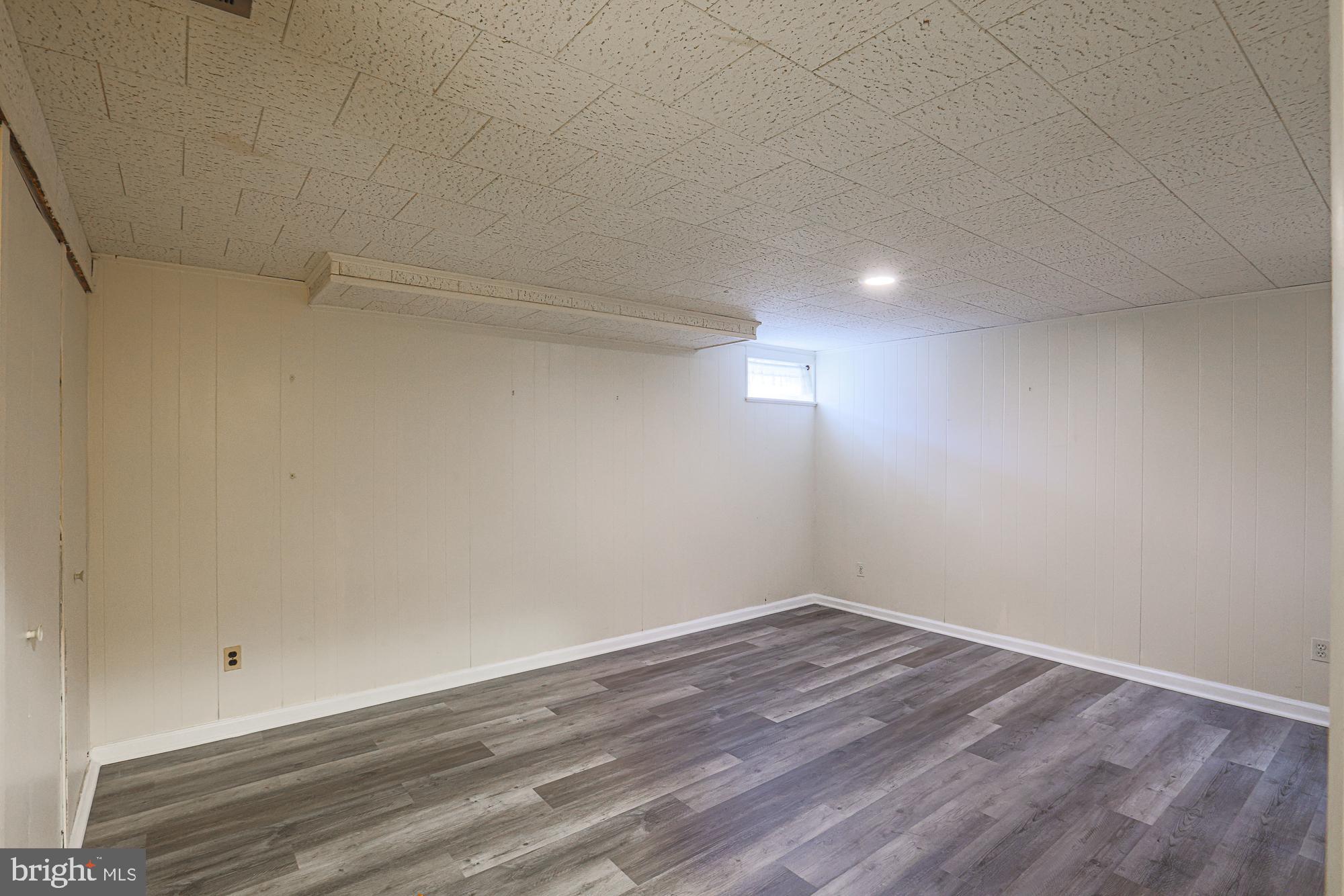 1522 Chivalry Court Rosedale, MD 21237 - Photo 27 of 36 a view of a room with wooden floor