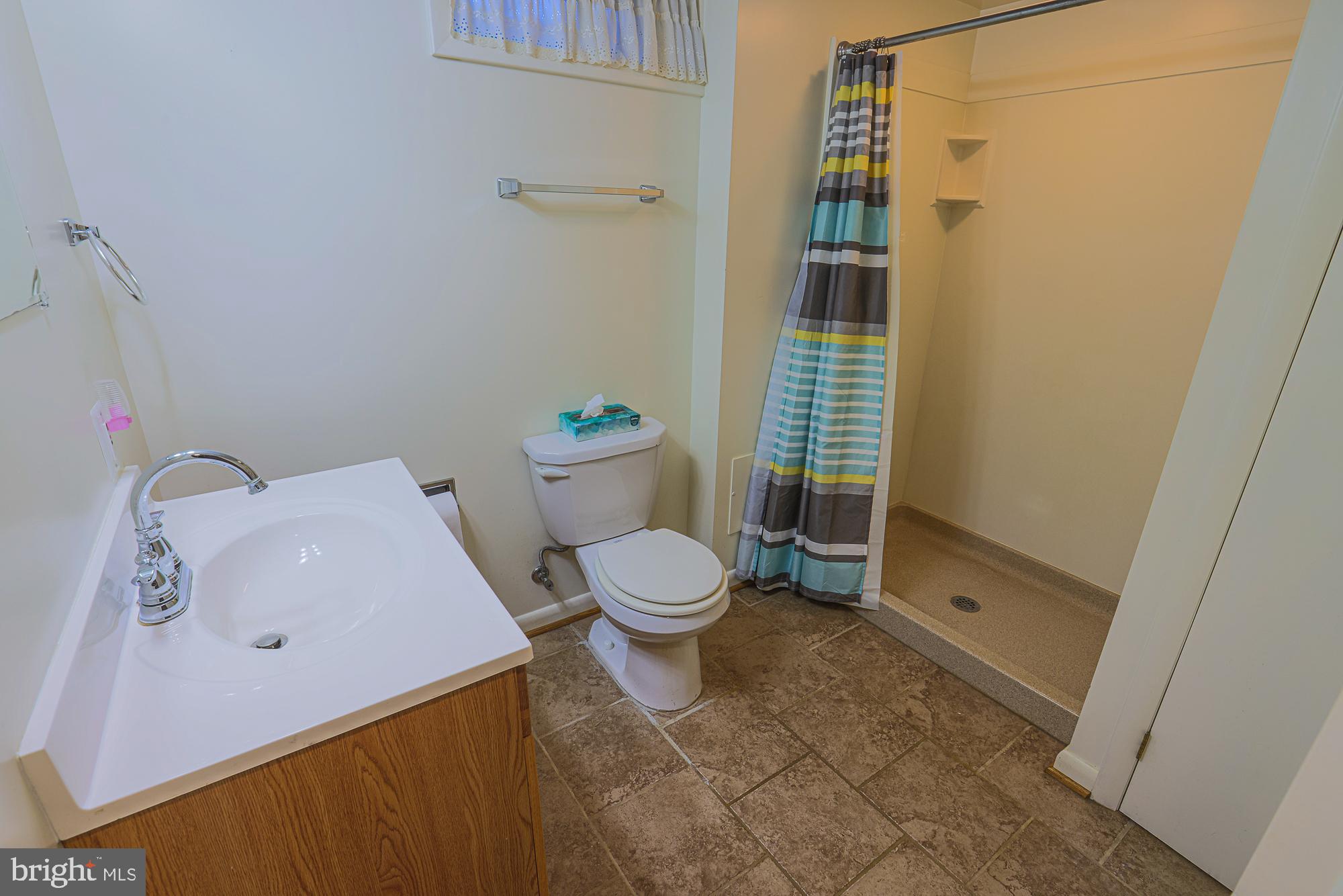 1522 Chivalry Court Rosedale, MD 21237 - Photo 28 of 36 a bathroom with a toilet and a shower
