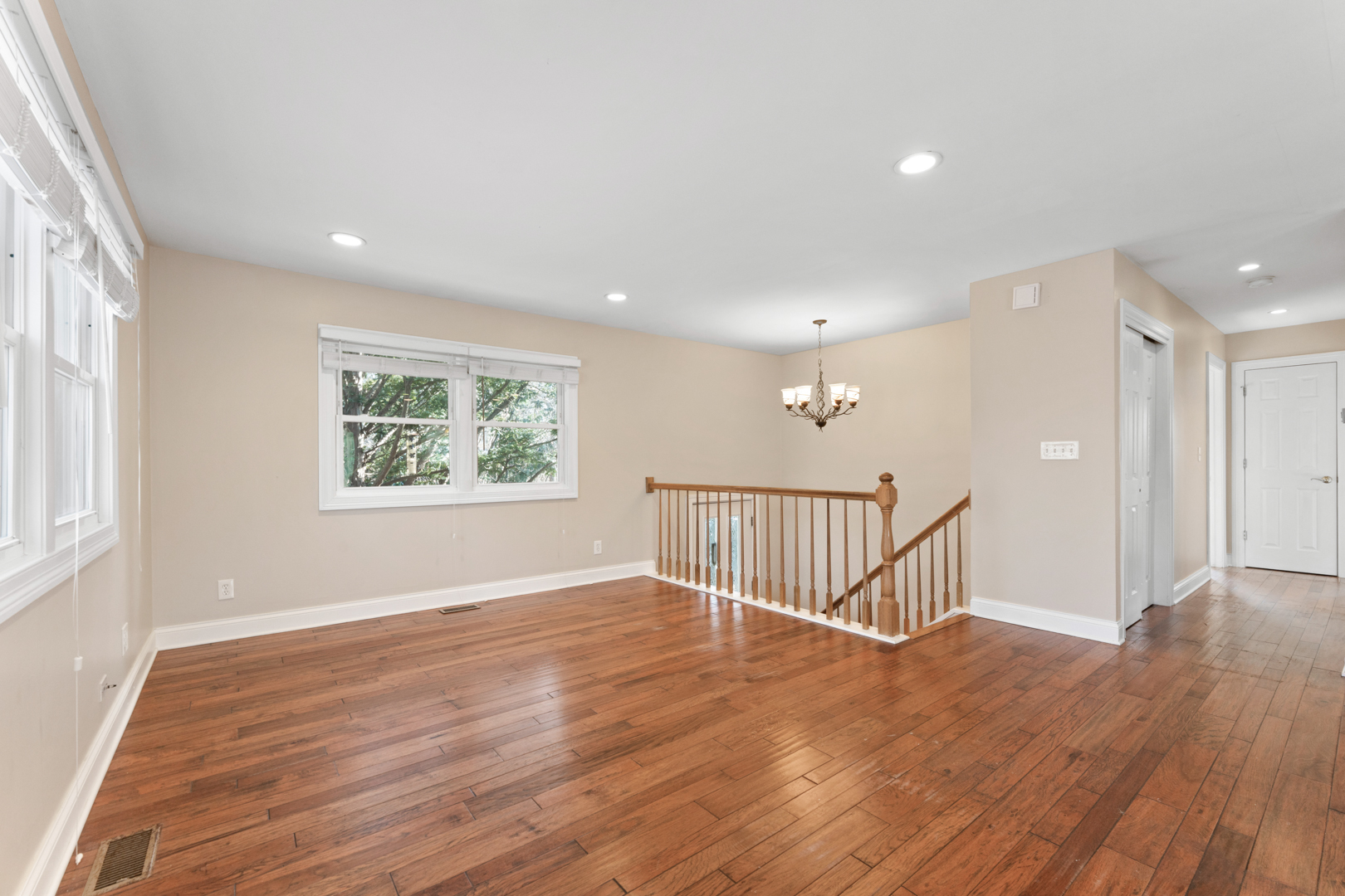 25 5n568 Il Rte Street St. Charles, IL 60174 - Photo 5 of 30 a view of an empty room with wooden floor and a window