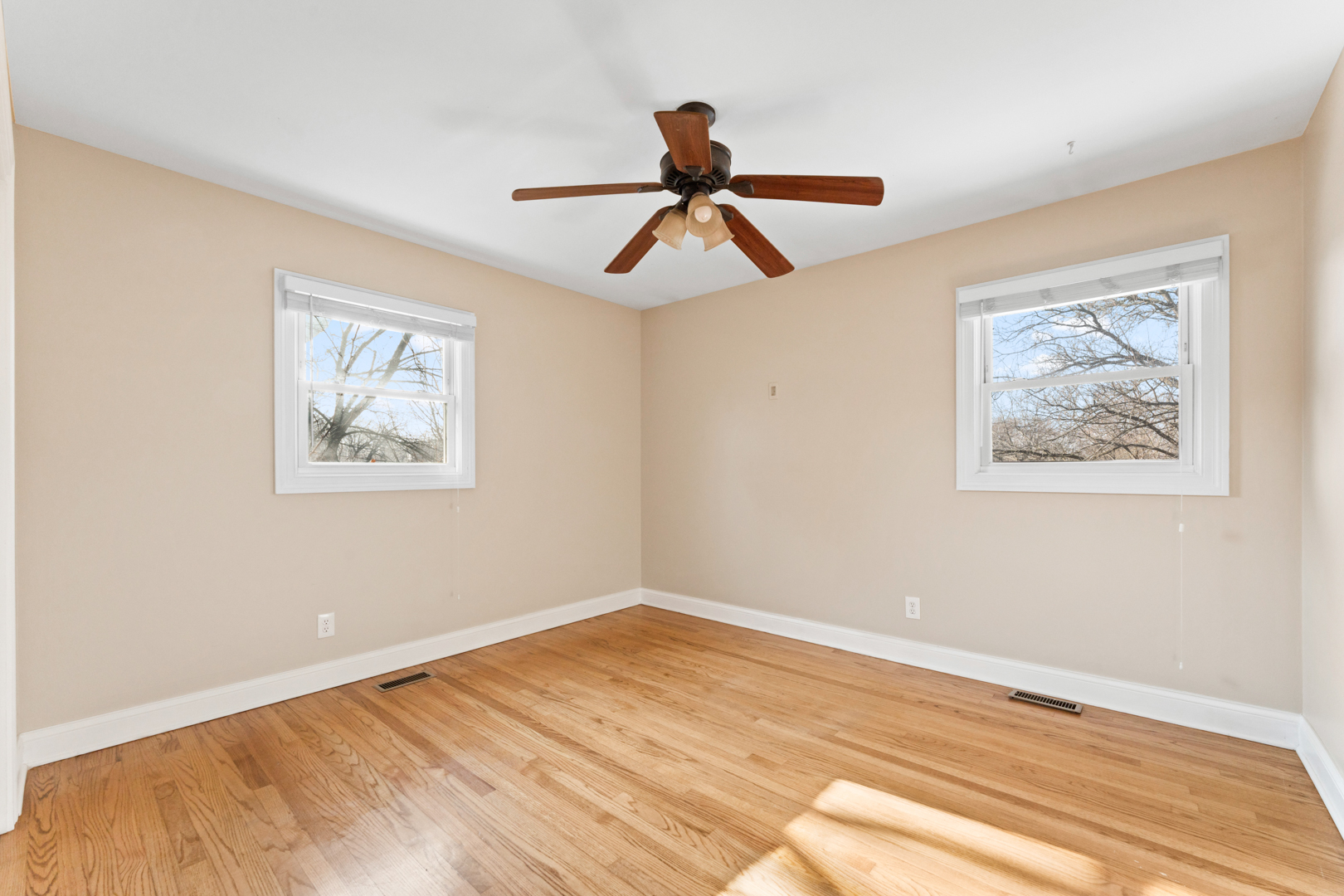 25 5n568 Il Rte Street St. Charles, IL 60174 - Photo 10 of 30 a view of empty room with wooden floor and fan