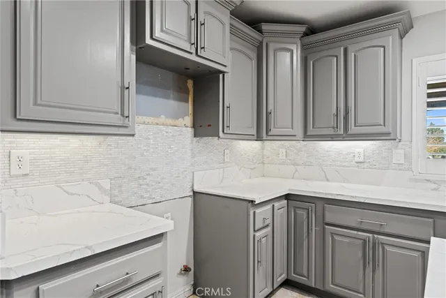 a kitchen with a sink and a refrigerator