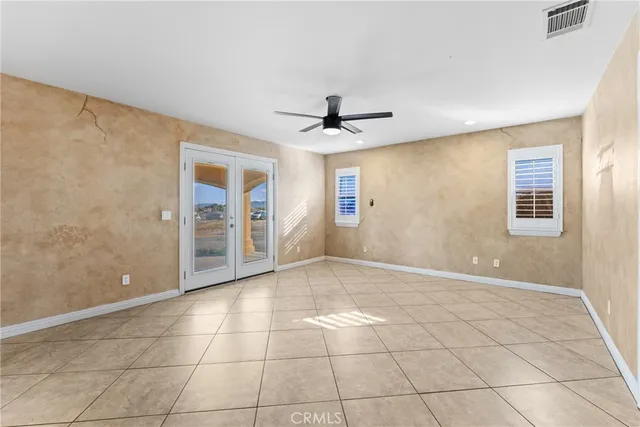 a view of a livingroom with a furniture and chandelier fan