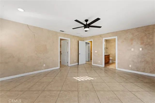 a bathroom with a granite countertop sink a mirror and a shower