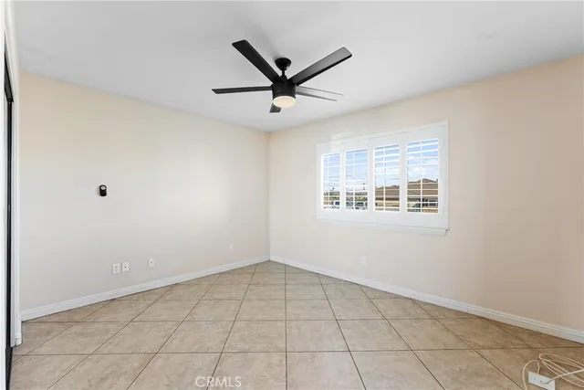 a bathroom with a granite countertop sink mirror vanity and toilet