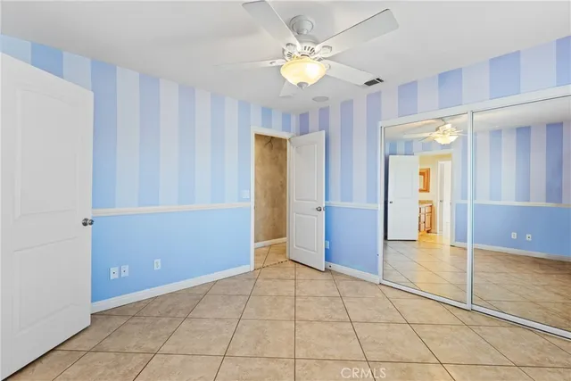 a bathroom with a shower a toilet and a shower