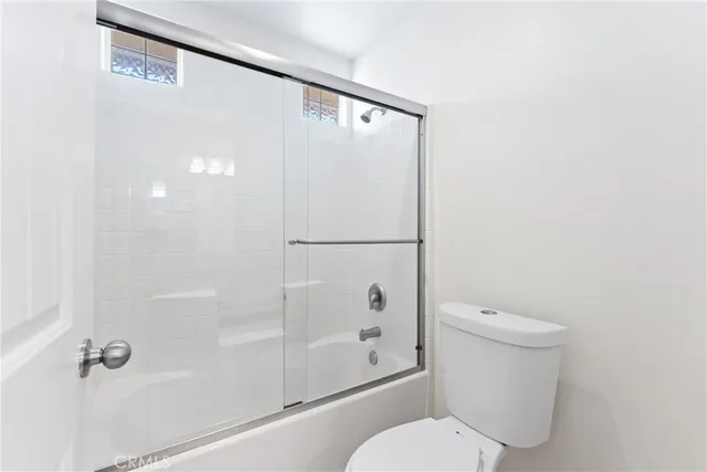 a view of a big room with wooden floor and a fireplace