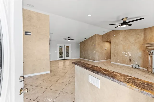 a spacious bathroom with a granite countertop sink a mirror and a shower