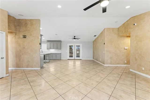 a view of a kitchen with a sink stainless steel appliances and cabinets