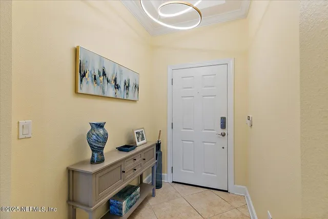 a view of an entryway with painting on the wall