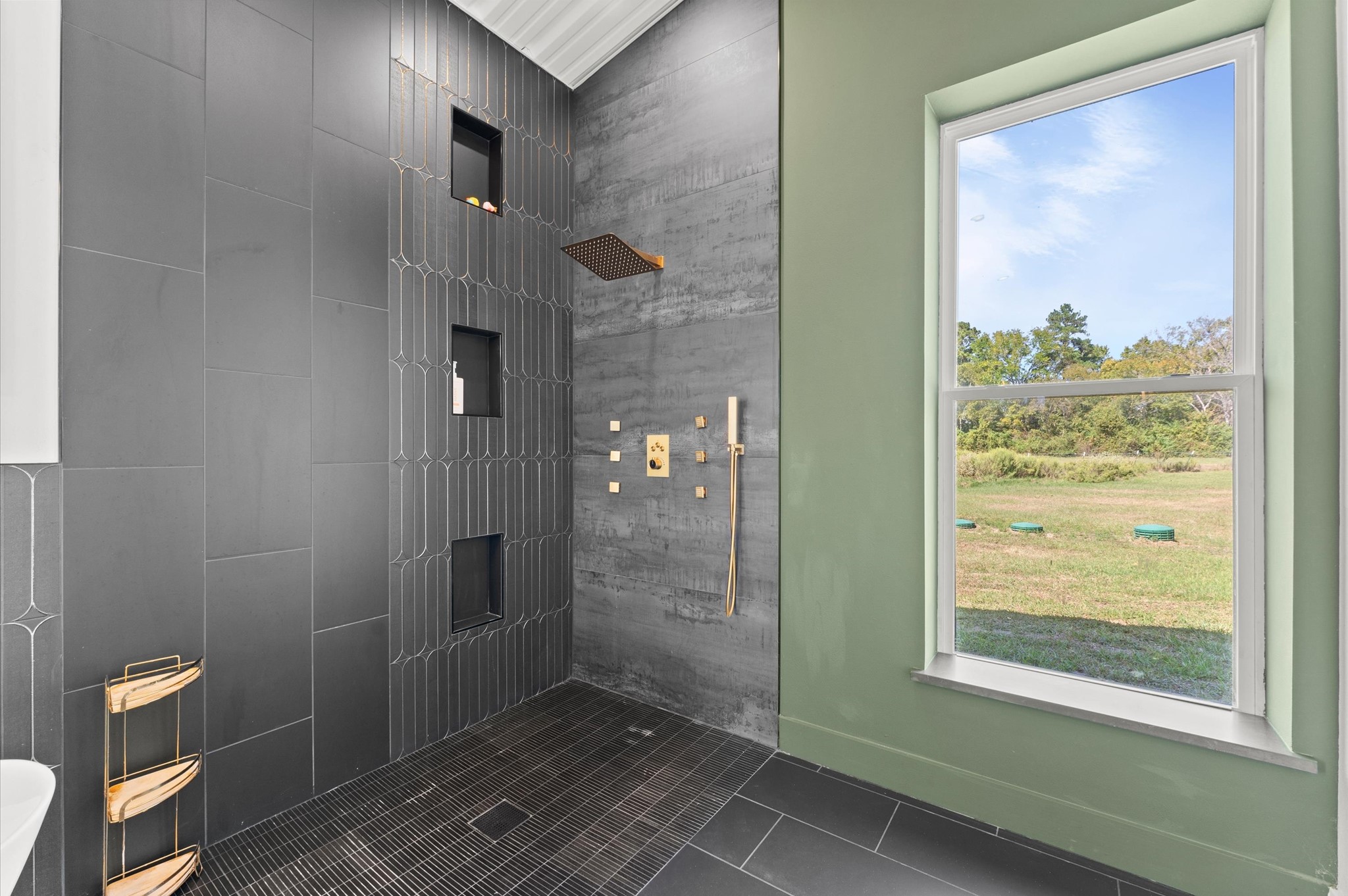 2743 Bobville Road Montgomery, TX 77316 - Photo 19 of 50 a bathroom with a glass shower door