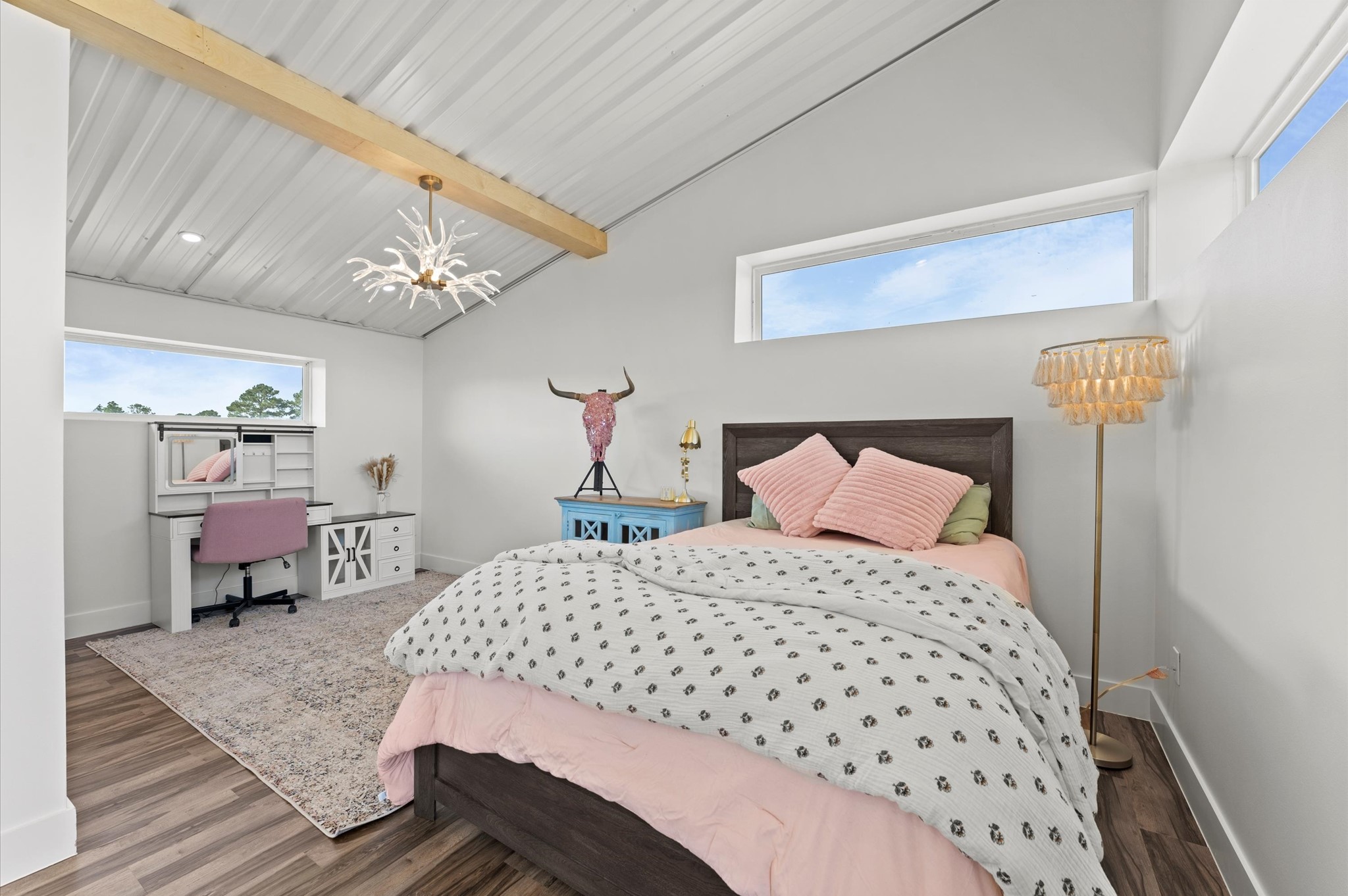 2743 Bobville Road Montgomery, TX 77316 - Photo 30 of 50 a bedroom with a bed and a chandelier