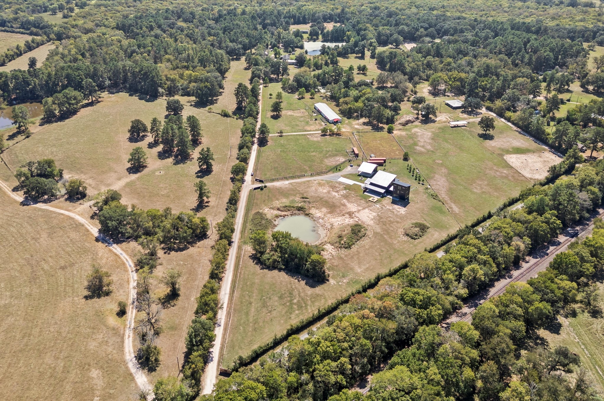 2743 Bobville Road Montgomery, TX 77316 - Photo 49 of 50 an aerial view of a house with a yard and lake view