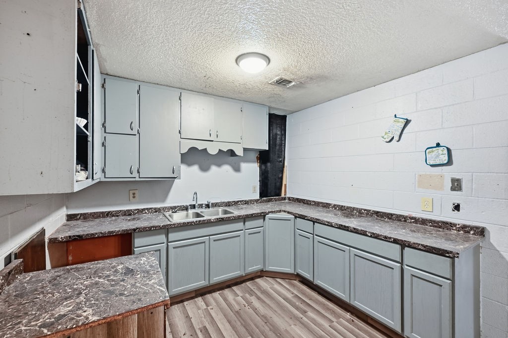 508 South Kenneth Avenue Monahans, TX 79756 - Photo 7 of 39 a kitchen with granite countertop a sink stainless steel appliances and cabinets
