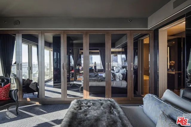 a bedroom with furniture and a window