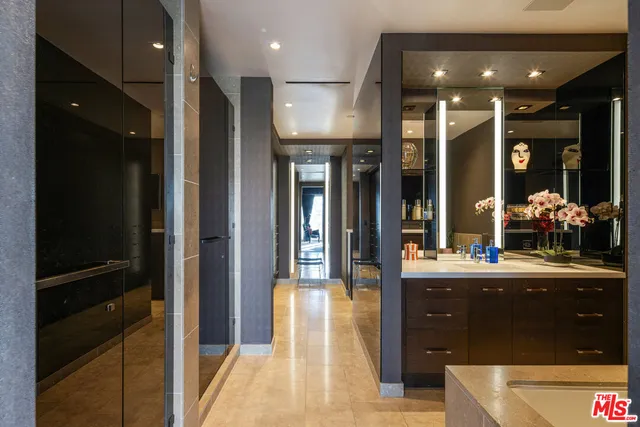 a kitchen with a refrigerator and a counter top space
