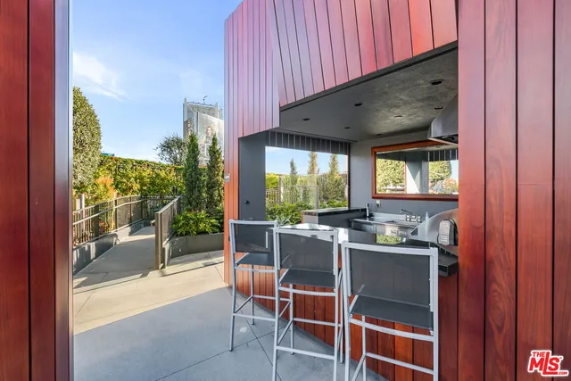 a dining room with furniture and a window