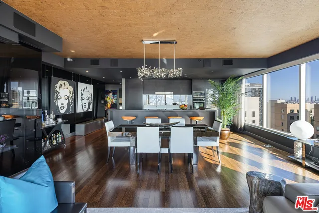 a view of a dining room with furniture wooden floor and chandelier