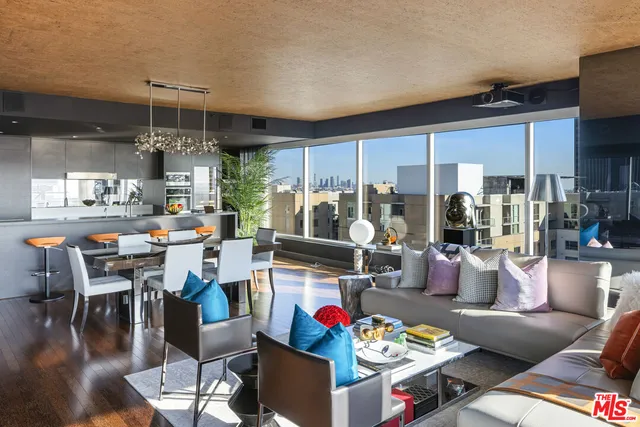 a living room with lots of furniture and white walls