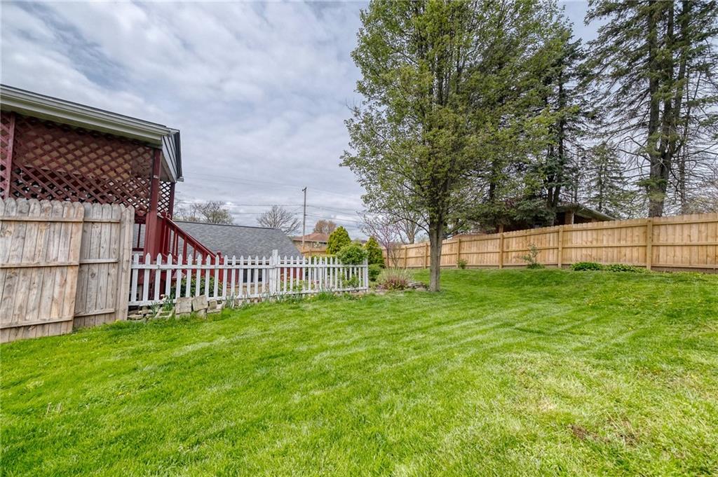 732 Charles Street Rochester, PA 15074 - Photo 13 of 38 a view of a deck with a big yard and large trees