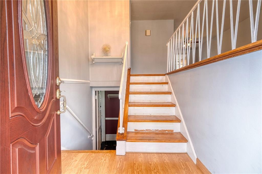 732 Charles Street Rochester, PA 15074 - Photo 15 of 38 a view of staircase with white walls and a window