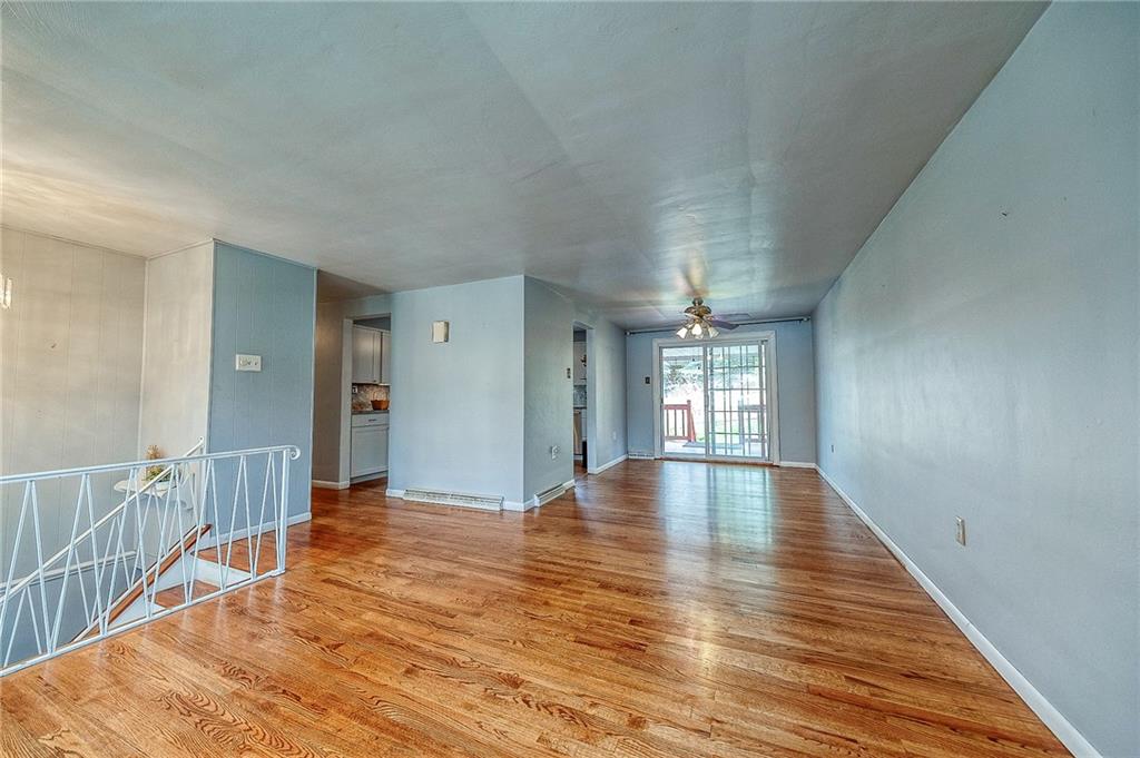 732 Charles Street Rochester, PA 15074 - Photo 17 of 38 a view of an empty room with window and wooden floor