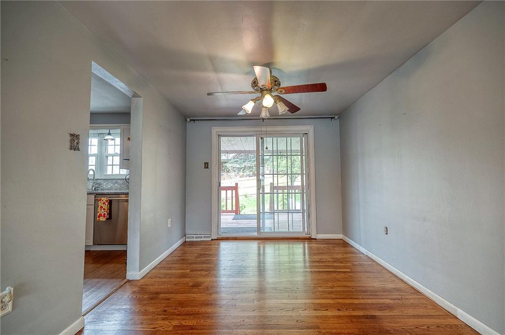 732 Charles Street Rochester, PA 15074 - Photo 20 of 38 wooden floor in an empty room with a window