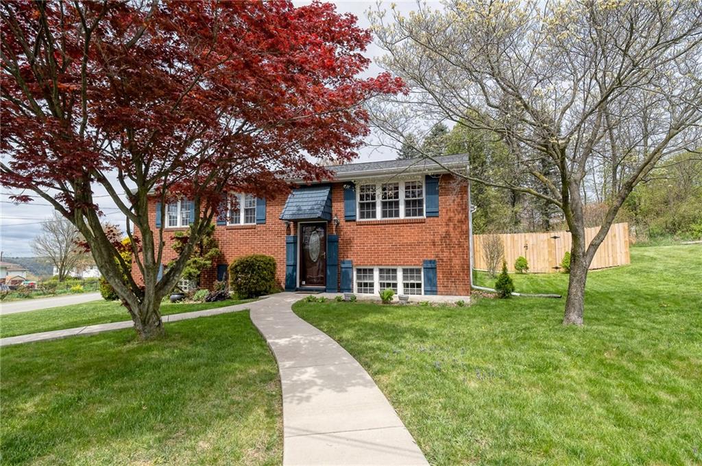 732 Charles Street Rochester, PA 15074 - Photo 2 of 38 a front view of a house with a yard
