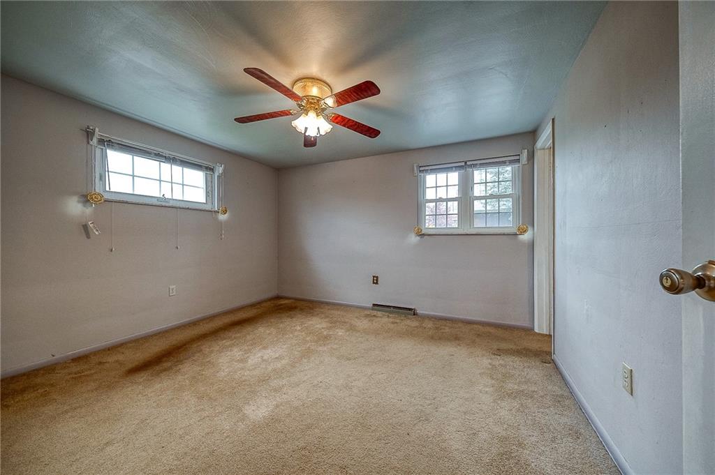 732 Charles Street Rochester, PA 15074 - Photo 27 of 38 an empty room with windows and fan