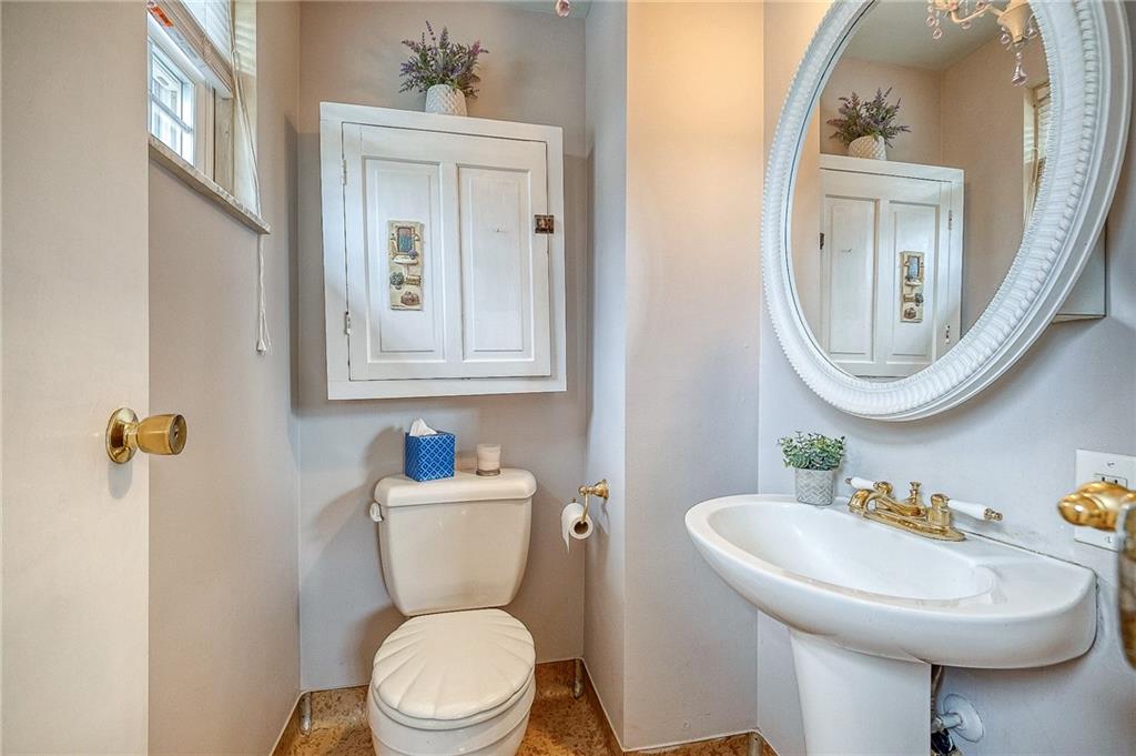 732 Charles Street Rochester, PA 15074 - Photo 28 of 38 a bathroom with a toilet a sink and mirror