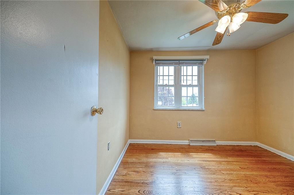 732 Charles Street Rochester, PA 15074 - Photo 29 of 38 wooden floor in an empty room with a window