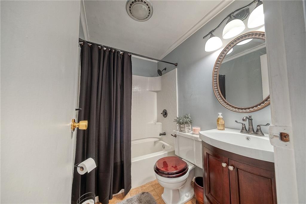 732 Charles Street Rochester, PA 15074 - Photo 32 of 38 a bathroom with a sink and a mirror