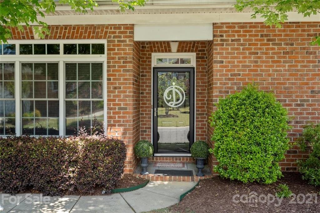 302 Shinnecock Lane Fort Mill, SC 29708 - Photo 1 of 36 a front view of a house with a garden