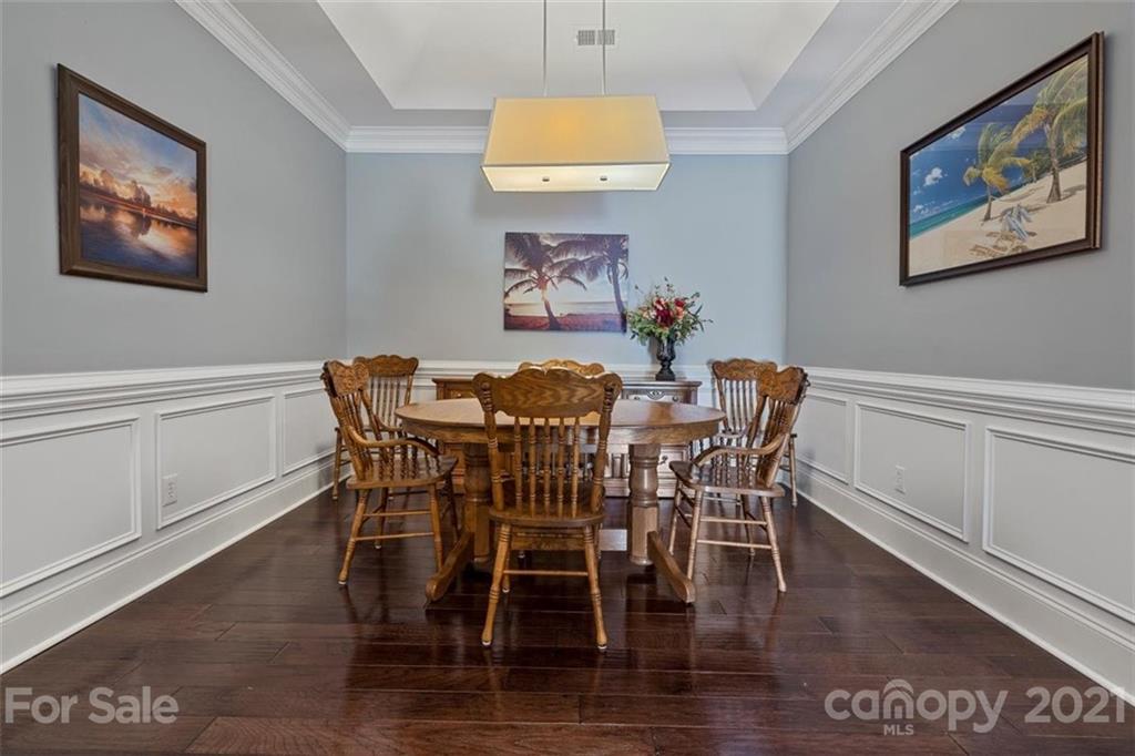 302 Shinnecock Lane Fort Mill, SC 29708 - Photo 11 of 36 a dining room with furniture and wooden floor