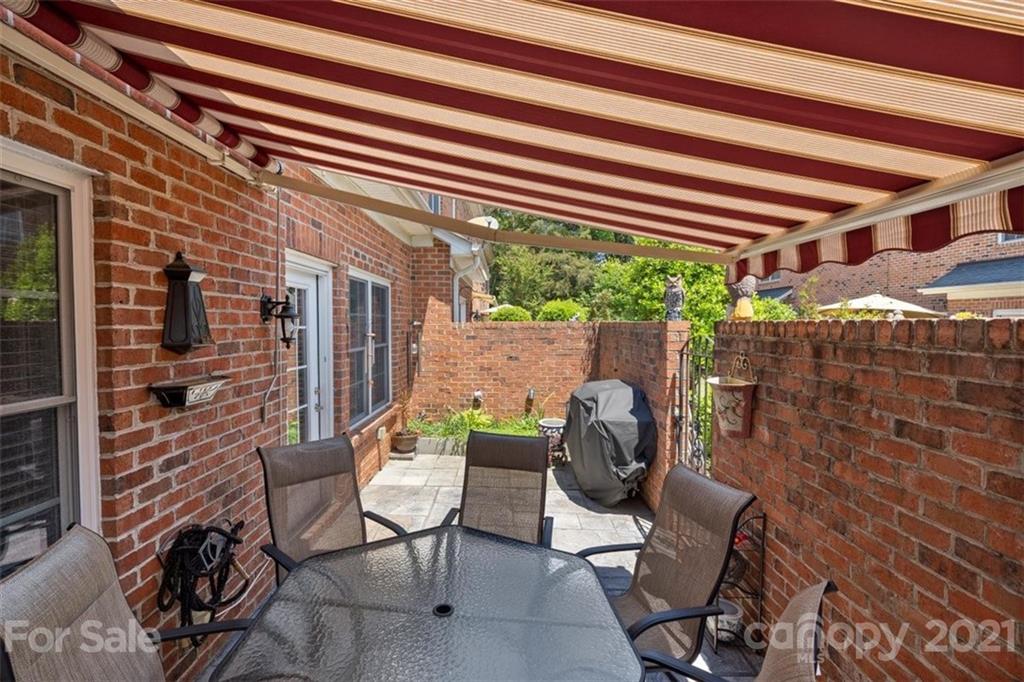 302 Shinnecock Lane Fort Mill, SC 29708 - Photo 29 of 36 a view of a chair and table in backyard