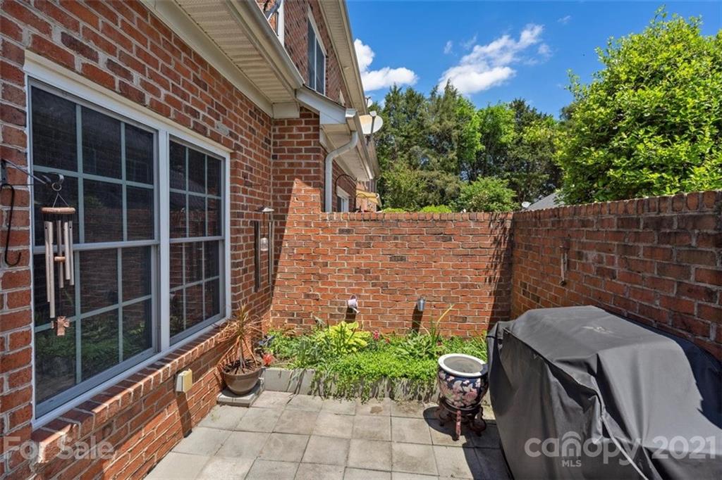 302 Shinnecock Lane Fort Mill, SC 29708 - Photo 30 of 36 a view of a backyard with chairs and a potted plant