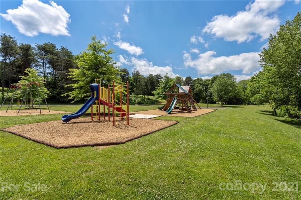 302 Shinnecock Lane Fort Mill, SC 29708 - Photo 36 of 36 a view of a park with swings and a slide
