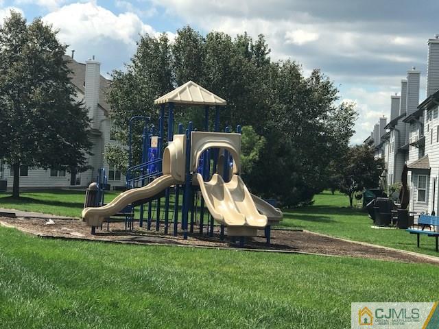 350 Lunar Road Piscataway, NJ 08854 - Photo 19 of 19 a view of a garden with a slide and table