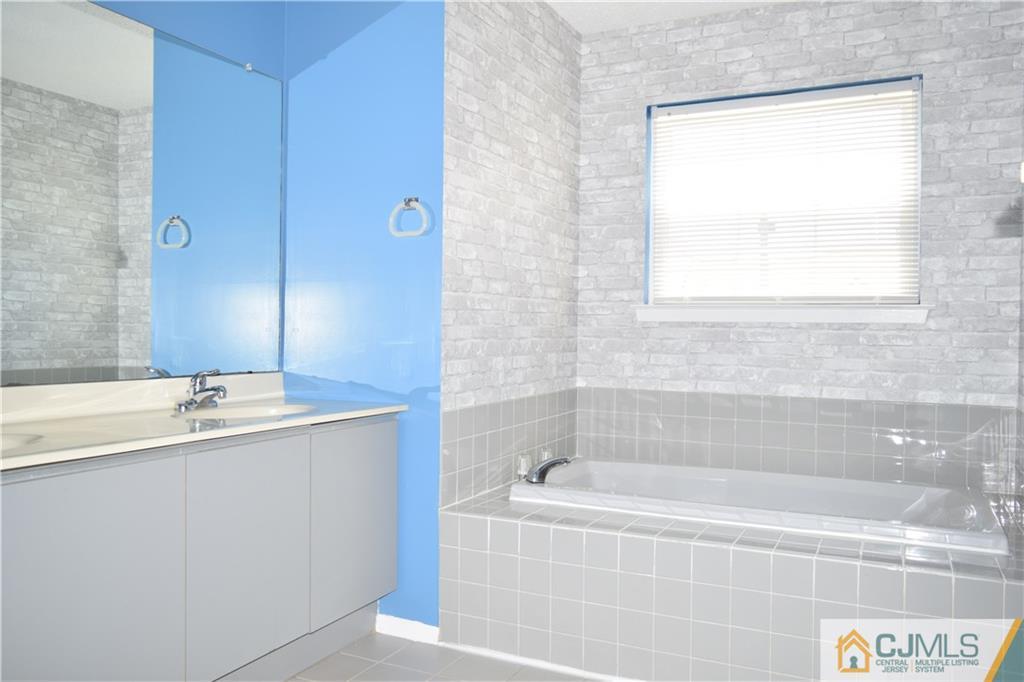 350 Lunar Road Piscataway, NJ 08854 - Photo 8 of 19 a bathroom with a bathtub and a sink