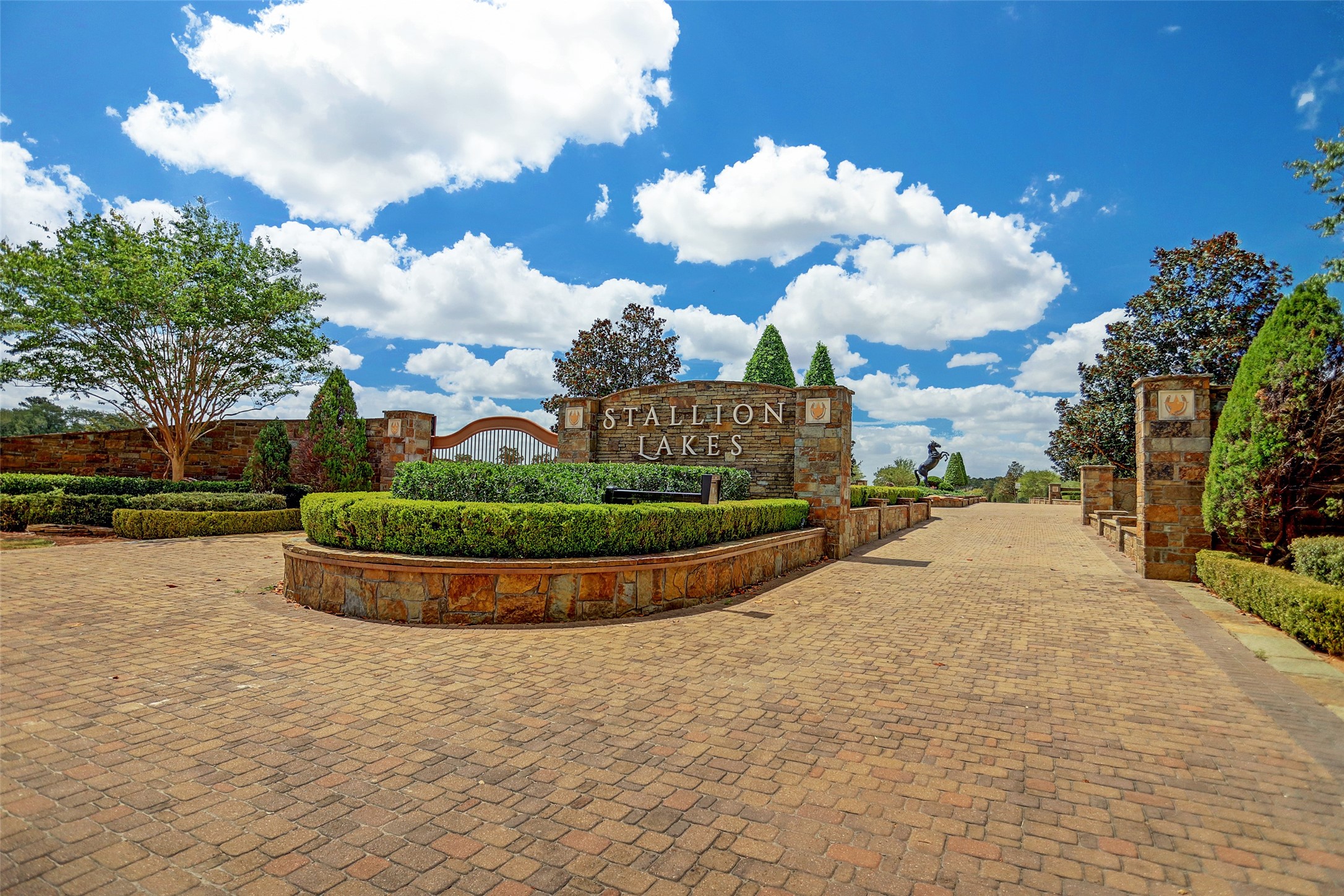 2044 Stallion Lakes Avenue Hockley, TX 77447 - Photo 6 of 17 The main entrance features manicured landscaping and a welcoming, estate-style approach. It sets the tone for the level of quality found throughout Stallion Lakes.