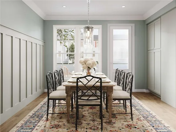 a view of a dining room with furniture window and wooden floor