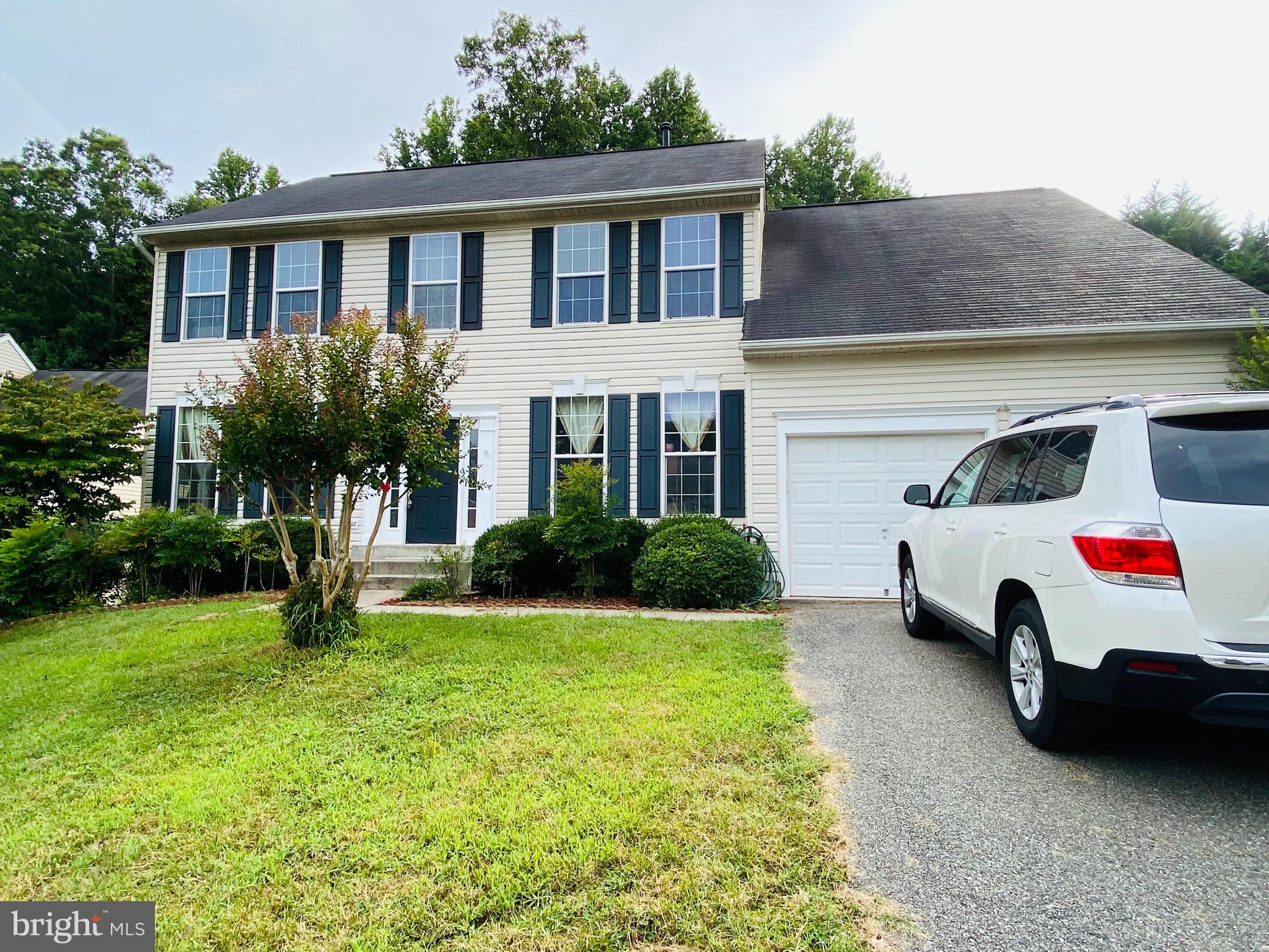 903 Johnson Grove Lane Bowie, MD 20721 - Photo 2 of 11 a house view with a garden space