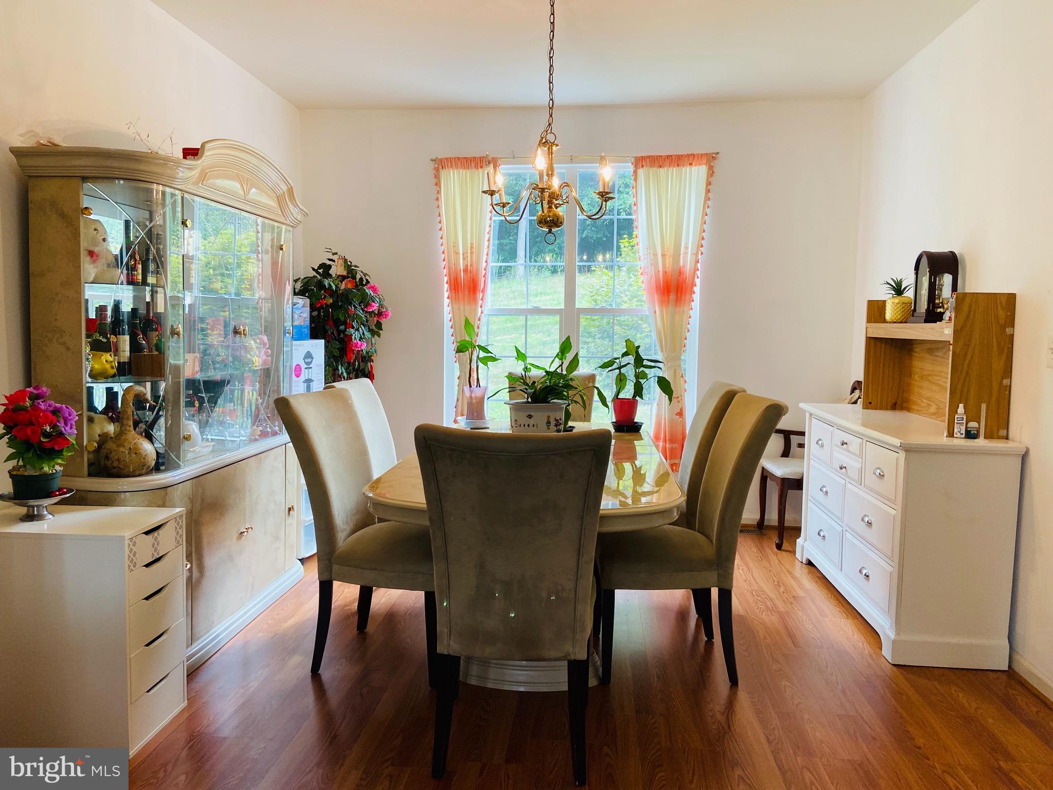 903 Johnson Grove Lane Bowie, MD 20721 - Photo 6 of 11 a view of a dining room with furniture window and outside view