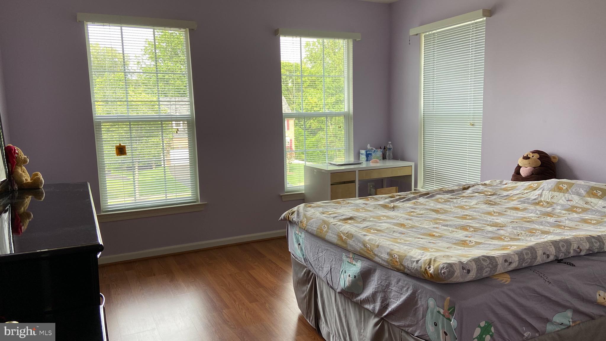 903 Johnson Grove Lane Bowie, MD 20721 - Photo 7 of 11 a bedroom with a bed and a window