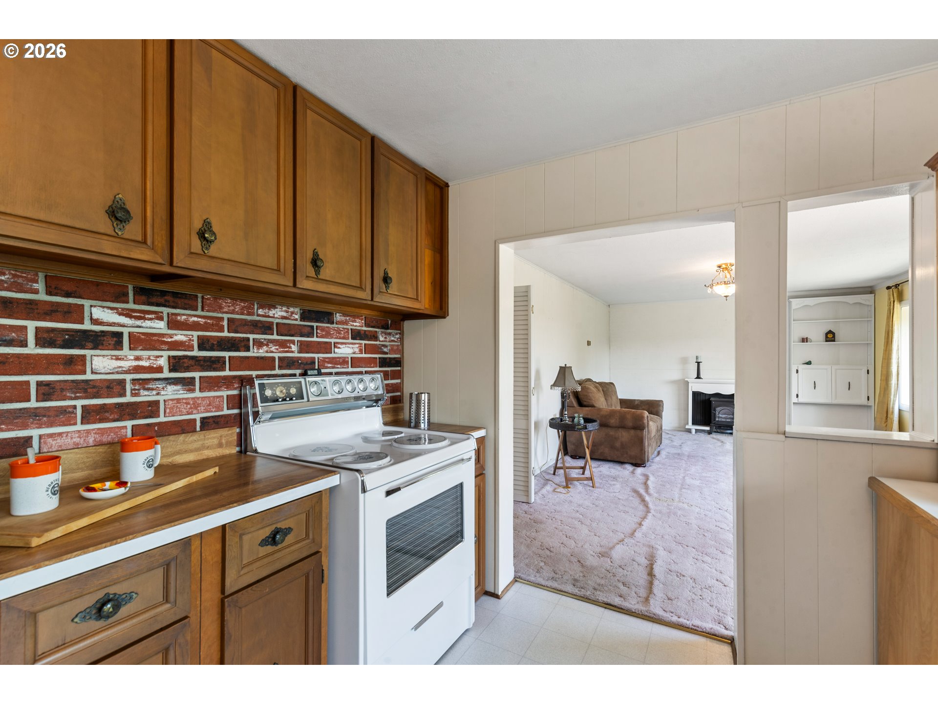 29538 Bridge Road Hermiston, OR 97838 - Photo 12 of 46 a kitchen with stainless steel appliances granite countertop a stove a sink and a microwave