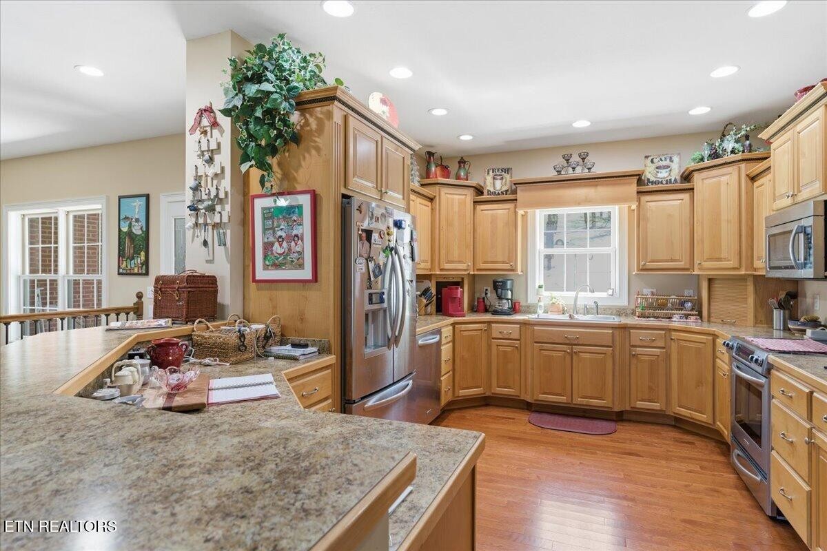 1999 Repass Road New Market, TN 37820 - Photo 11 of 52 a kitchen with sink refrigerator and microwave